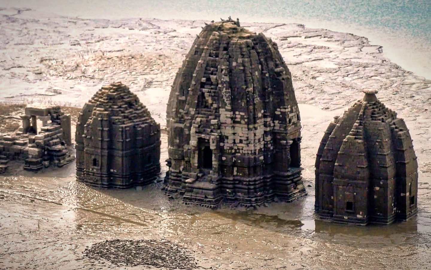 Old Bilaspur temples rising from Gobind Sagar lake near Naina Devi