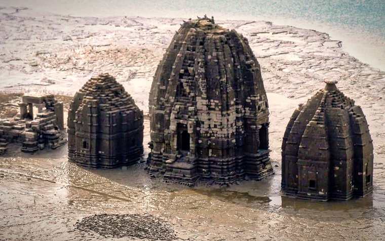 Old Bilaspur temples rising from Gobind Sagar lake near Naina Devi
