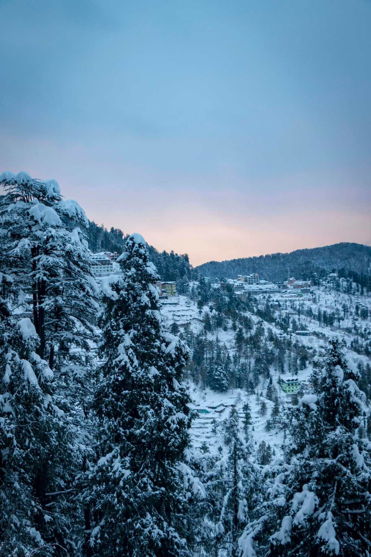 Shimla under fresh snow at dusk