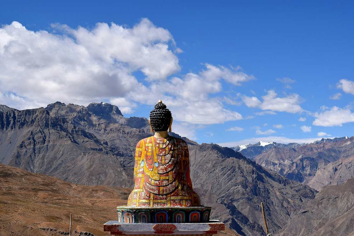 Buddha statue facing the mountains of the Spiti valley