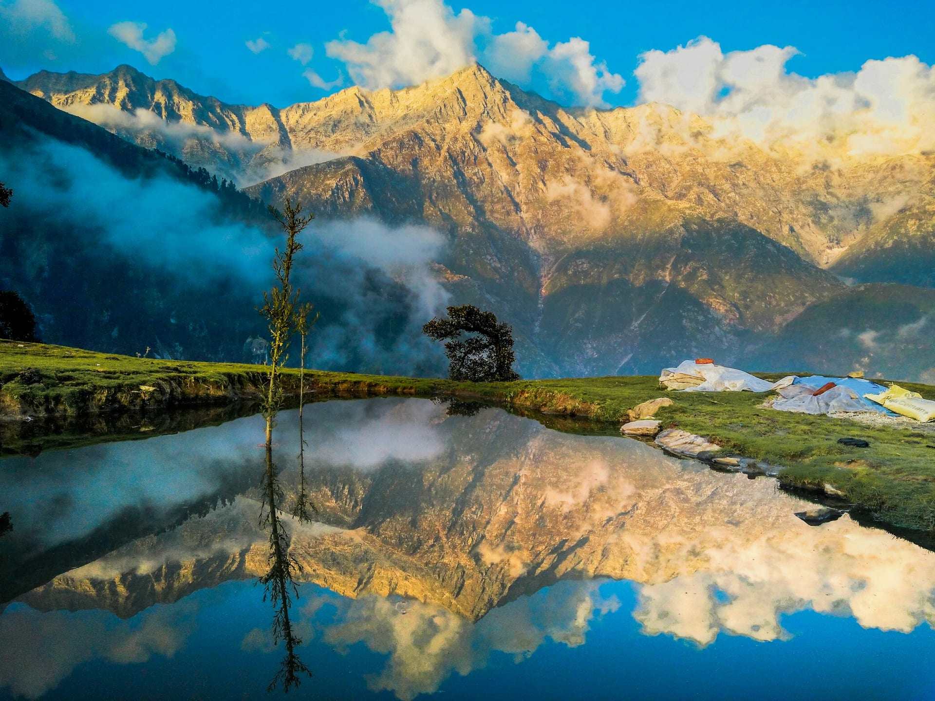 Sunrise on the Dhauladhar, reflected in a pool at Triund above McLeodganj